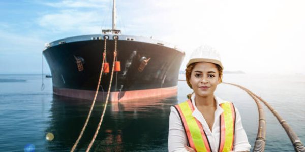 mixed race woman engineer staff worker and oil tanker ship background concept.